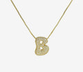 Cadena inicial bubble dorada con zirconias