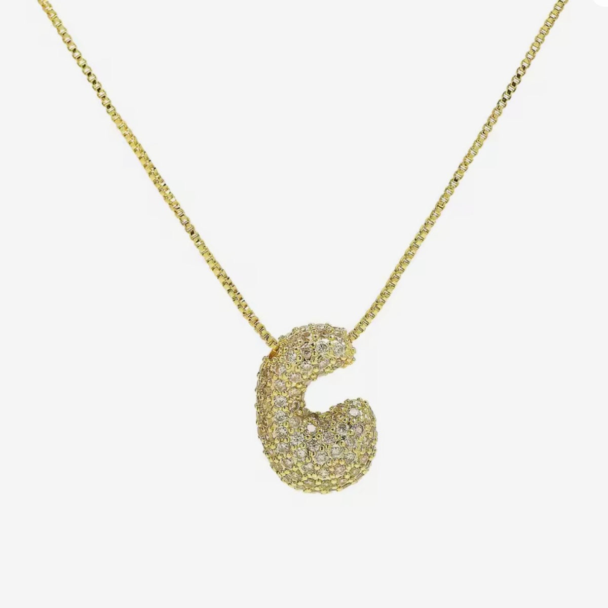 Cadena inicial bubble dorada con zirconias